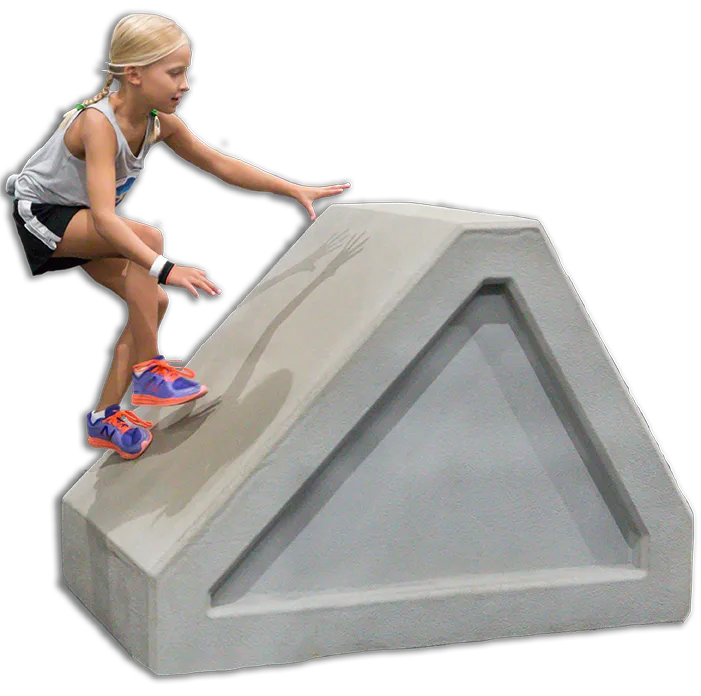 Young girl climbing up angled steps obstacle.